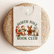 Load image into Gallery viewer, "North Pole Book Club" Christmas Tee