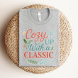 Load image into Gallery viewer, "Cozy Up With a Classic" Winter Themed Tee