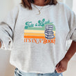 Load image into Gallery viewer, "Take a Look, It's in a Book" Retro Book Lover's Unisex Sweatshirt